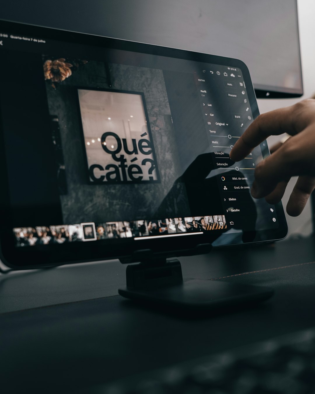 Video editor reviewing a documentary timeline on multiple monitors